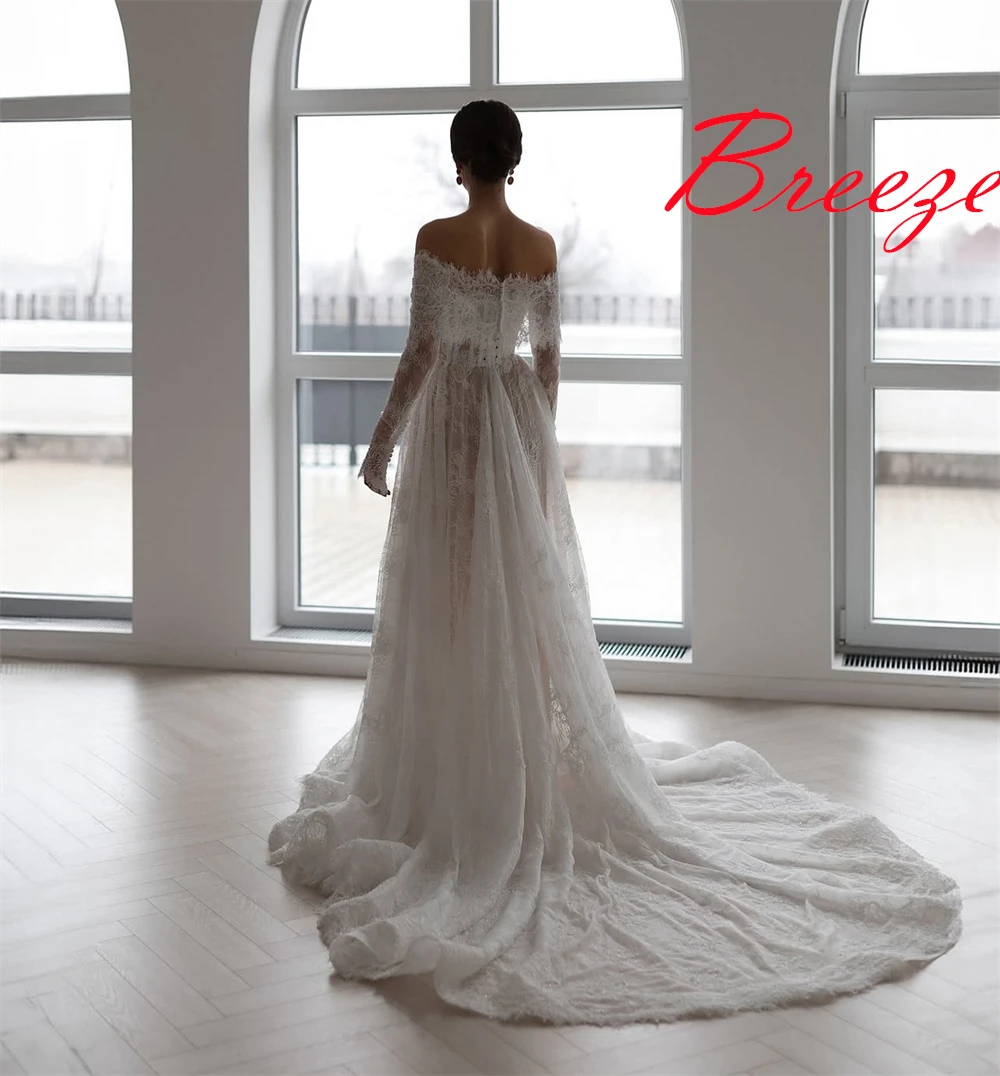 Op maat gemaakte witte organza trouwjurk van hoge kwaliteit, prachtige boothals, lange mouwen, kapelsleep, kanten rugloze bruidsjurken