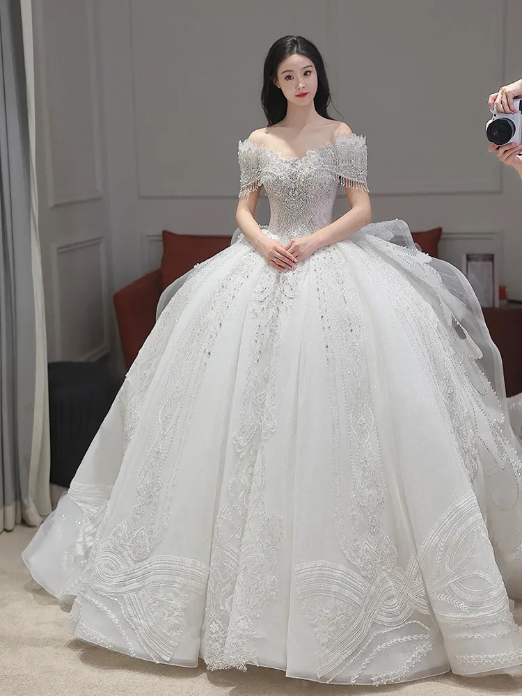 Robes de mariée à paillettes robe de soirée de mariage haut de gamme avec traîne brosse robe de mariée de luxe personnalisée 2026 robes de mariée brillantes