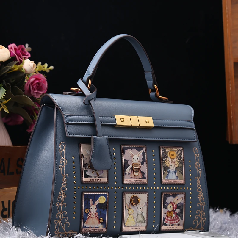 

Luxury and Vintage Shoulder Tote Bag with Delicate Cartoon Cat Embroidery and Rivet Design Women Popular and Unique Handbag