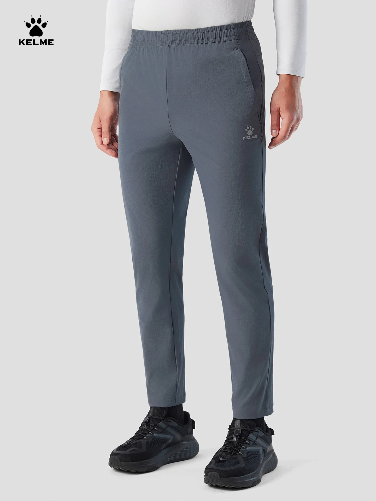 Kelme الرجال السراويل الرياضية التجفيف السريع الخريف السراويل المنسوجة التدريب سراويل تقليدية المشي لمسافات طويلة في الهواء الطلق تشغيل السراويل