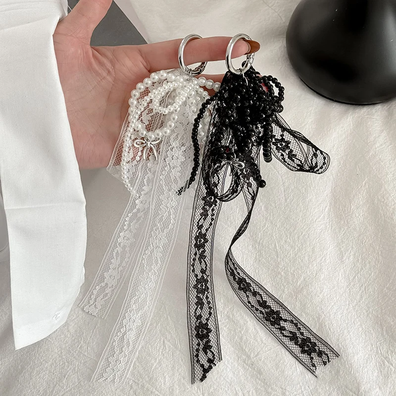 تقليد اللؤلؤ الدانتيل Bowknot المفاتيح الحلو مطرز قلادة كيرينغ للنساء حقيبة يد وحقيبة الظهر مفتاح سلسلة حلية رائعة