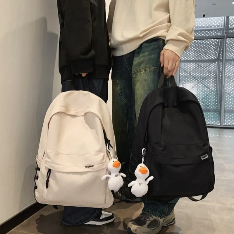 Minimalist School Commuter Backpack with Detachable Duck Plush Keychain Multi Pocket Lightweight Rucksack for Students Travel