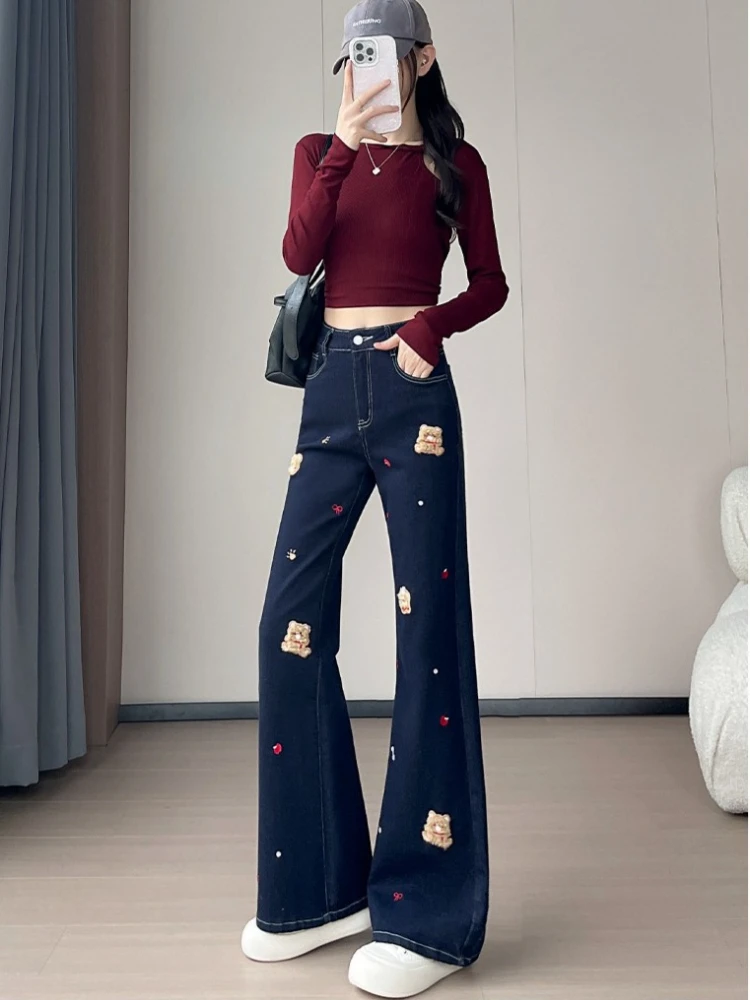 Cartoon embroidery micro flared jeans for women in winter 2025 with added velvet thickened and slim fit straight-leg pants
