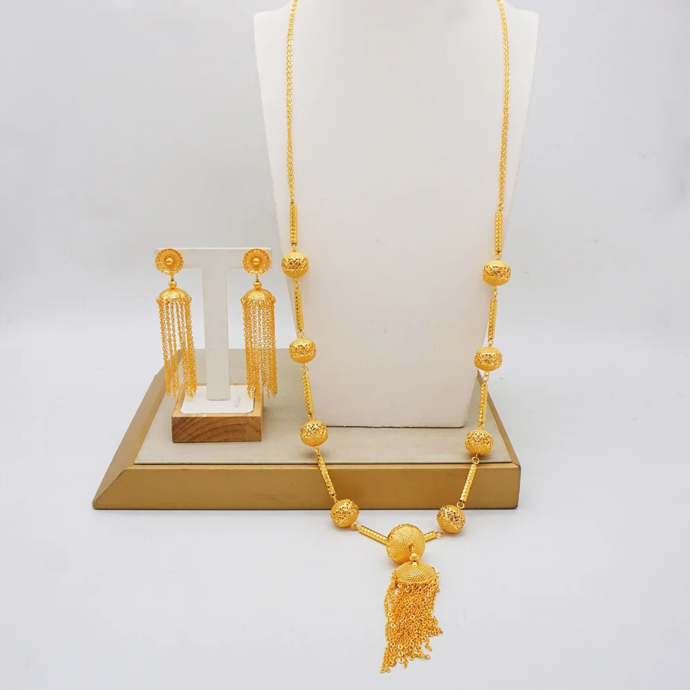 

Women's 24K Gold Set | Traditional chiseled cloud patterns, tassel necklace, pearl - accented earrings, classic & noble