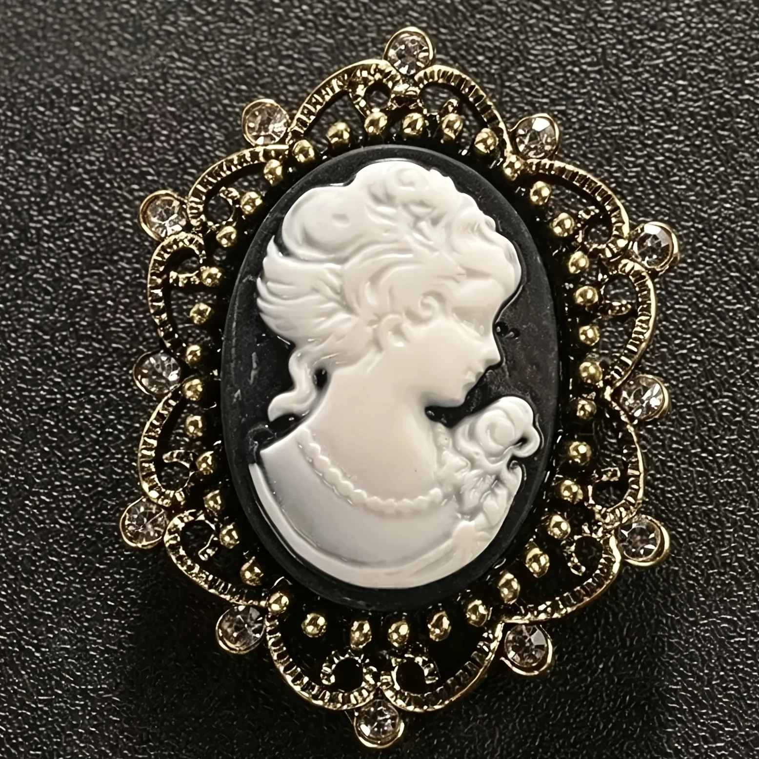 Vintage-Style Cameo Brooch, Crafted With An Antiqued Gold-Tone Openwork Design. A Victorian-Inspired Statement Piece Suit