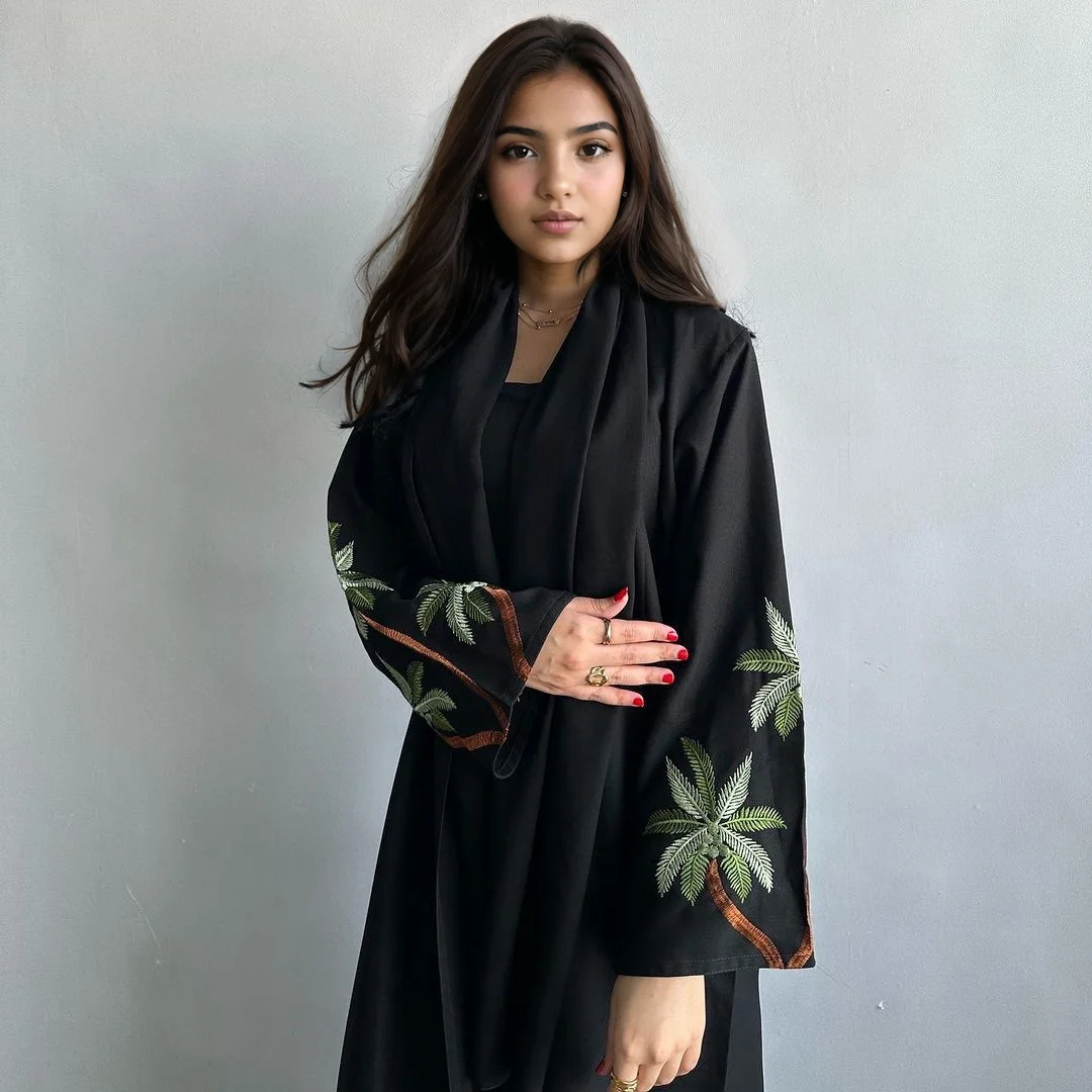 Black Muslim women\'s long robe dress with embroidered design, long robe