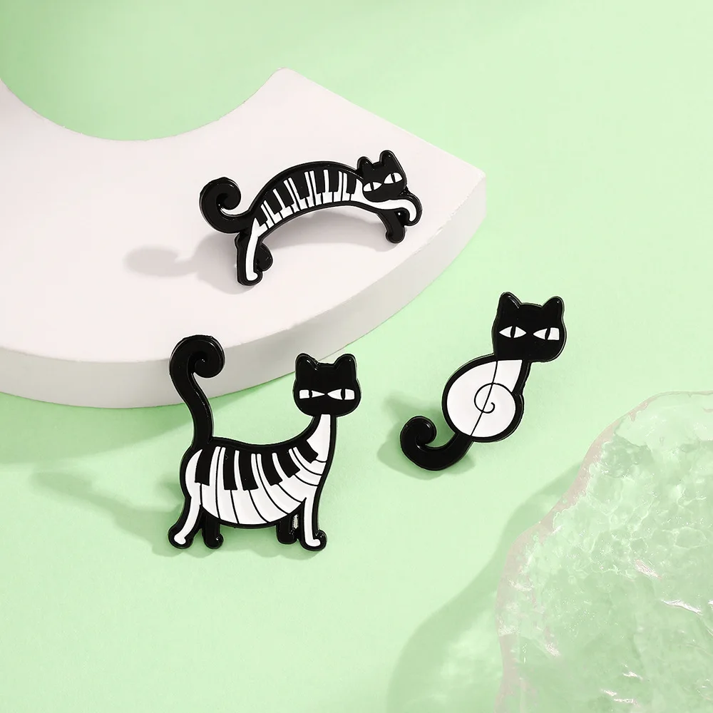 Black and white piano keys, happy cat, connected yoga movements, funny cat notes, creative cat, animal brooch