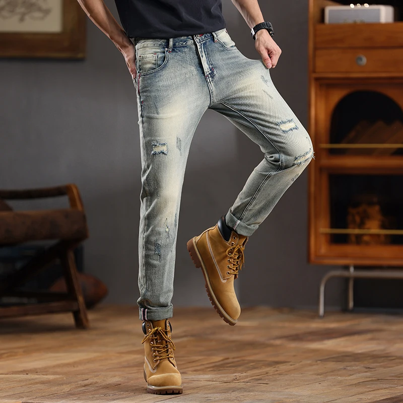European and American retro distressed jeans men's fashionable slim fit small feet ripped casual pants skinny jeans men