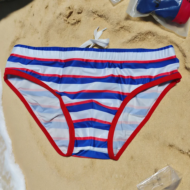 

Фото с реального склада: оригинальные мужские пляжные плавки-брифы с цветными полосками, модель 10080