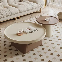 A combination of small units in the living room, family, cream style circular coffee table, antique style table, large and small