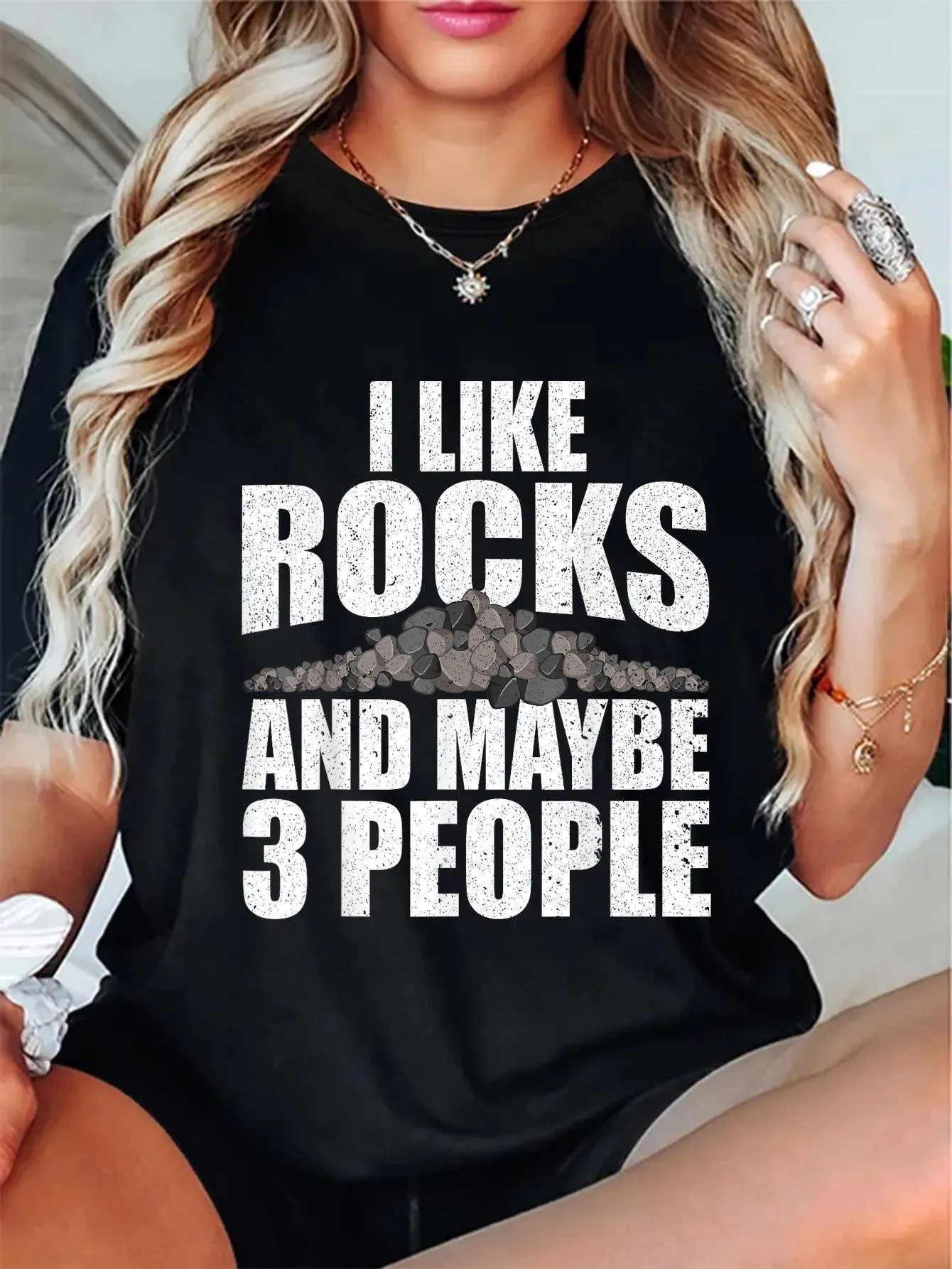 

Black Casual Women's T-Shirt with the Saying, "I Like Rocks and Maybe Three People."