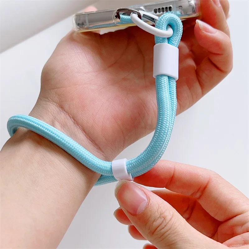 Universele verstelbare polsband voor mobiele telefoon, kort met zelfsluitend anti-drop-ontwerp, duurzame polyester INS-telefoonriem