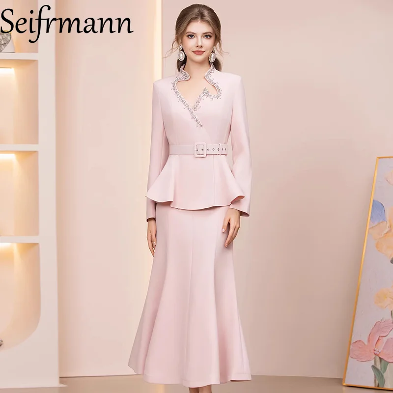 

Костюм-двойка Seifrmann 2026: Новое модное женское пальто с воротником-стойкой, длинными рукавами и поясом, украшенное стразами + юбка-«рыбий хвост»