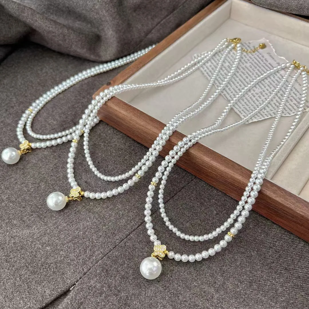 

New retro high-quality high-gloss double-layer cold white shell pearl necklace sweater chain pendant