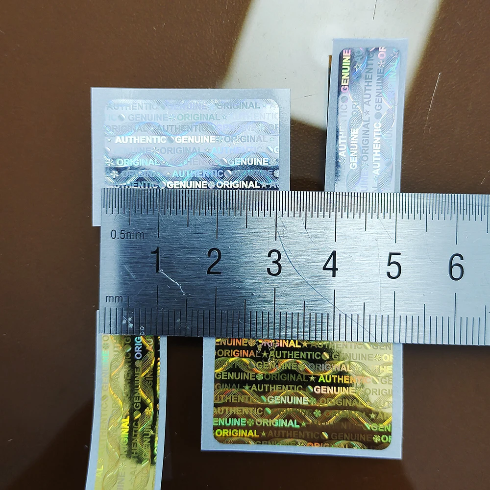 5000 قطعة/لفة الهولوغرام ملصق الأمن الختم حقيقي أصيلة الأصلي التسمية باطلة اليسار إذا العبث إزالة برهان مكافحة وهمية