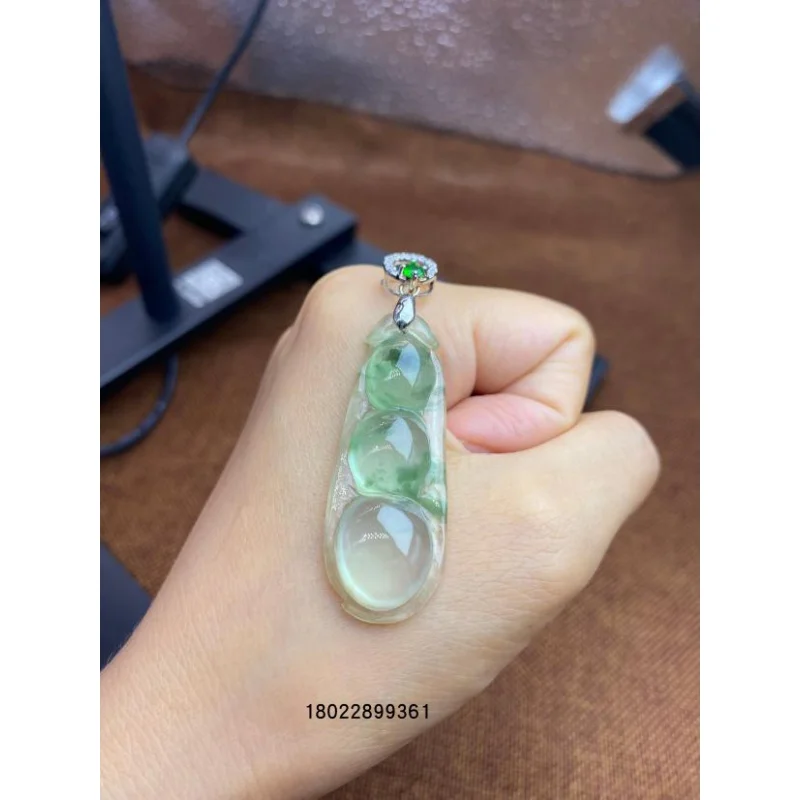 Natural a Ice-like Floating Green Jade Pendant with Green Bean White Background