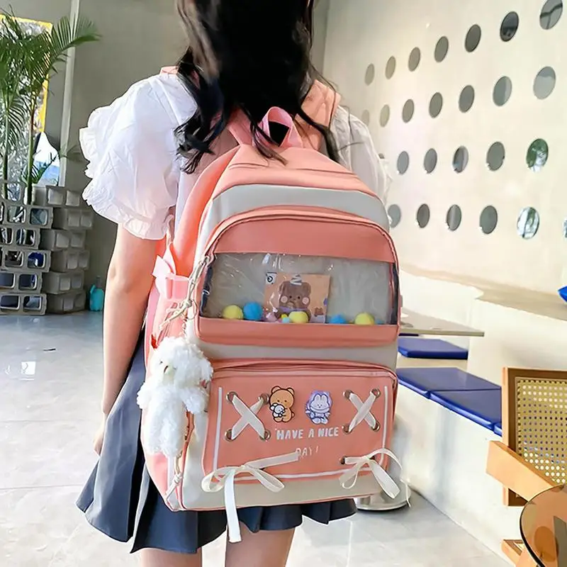 ชุดกระเป๋าเป้สะพายหลังสำหรับเด็กผู้หญิง5ชิ้นกระเป๋าเป้โรงเรียนสวยงามพร้อมหมุดและจี้ตุ๊กตาขนาดใหญ่กันน้ำน่ารักสำหรับสั้น