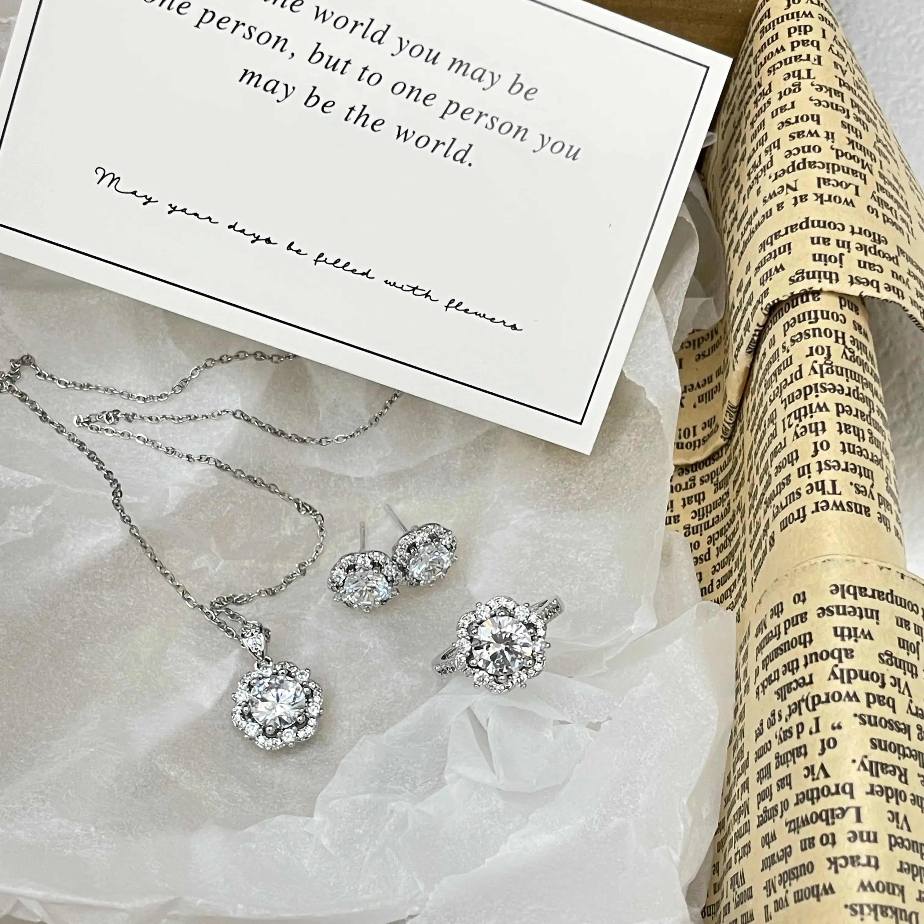 

Attractive Full diamond plum blossom-shaped ring set - three-piece earrings, necklaces and pendant - perfect for special dates.