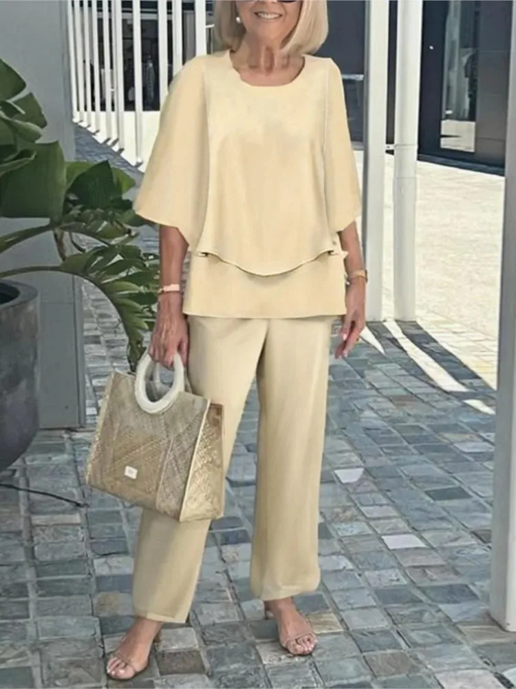 夏の新 2 点セット女性の O ネック 3/4 袖プリントパンツスーツカジュアルルーズ不規則なトップ + ワイドレッグパンツ 2 点セット