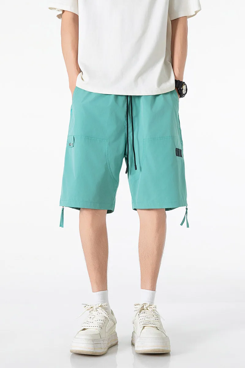 Celana pendek warna solid pria dengan desain ritsleting samping, celana pendek serut elastis kasual, pinggang longgar dan bernapas, spo cepat kering