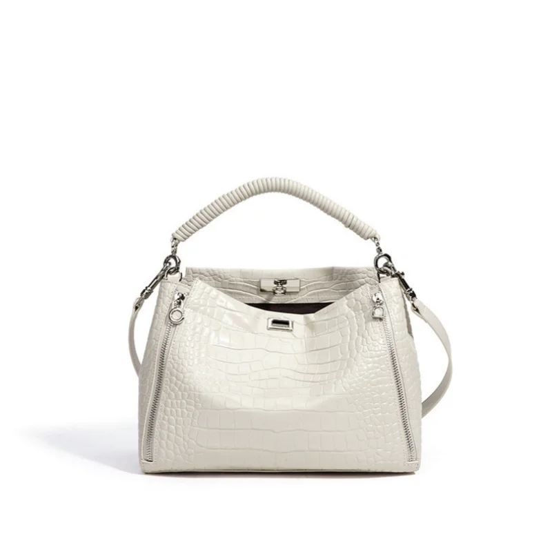 

Женская сумка из натуральной кожи с тиснением под крокодила, с плетеной ручкой, множеством молний и поворотным замком, на плечо