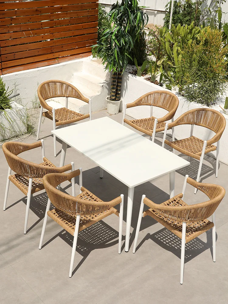 Outdoor tables and chairs with umbrellas, rattan chairs, white rattan woven Nordic outdoor tables and chairs