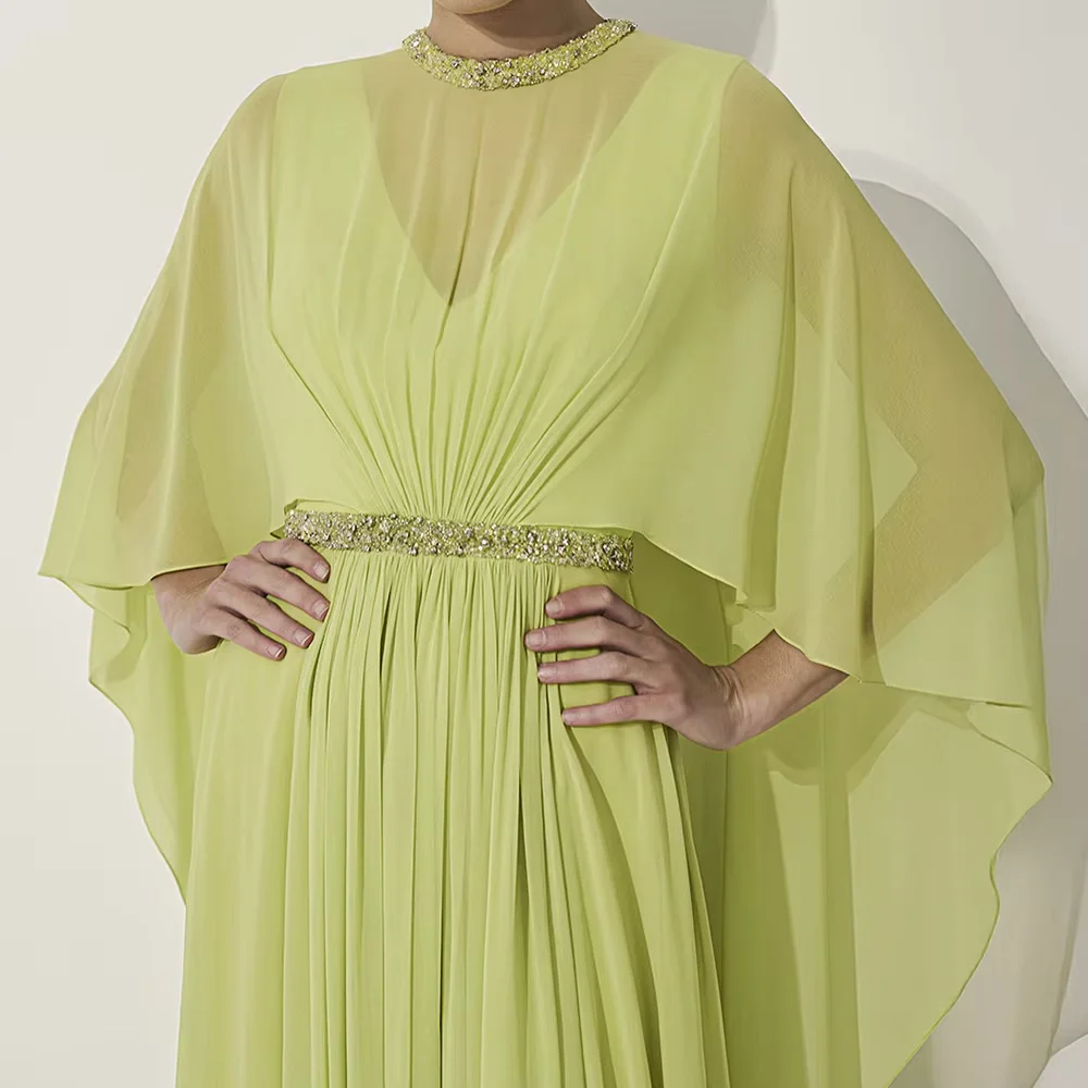 Elegant modest maxi abaya dress with cape sleeves and pleated long skirt. Soft chiffon fabric, matched waist belt. Suitable for