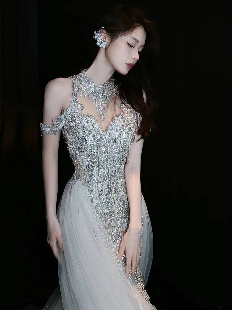 

New fitted fishtail wedding dress with a heavy trailing