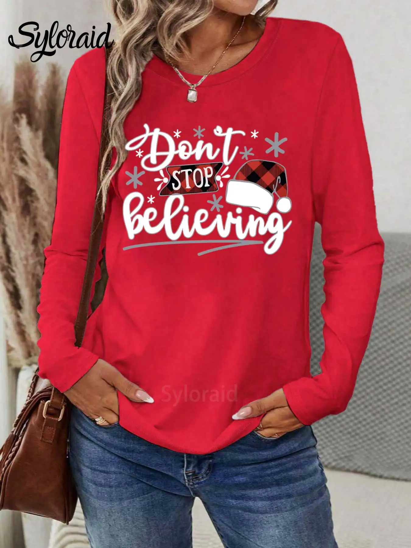 レディース長袖Tシャツ「Don't Stop Believing」クリスマスハットプリントTシャツファッションラウンドネックカジュアルトップ
