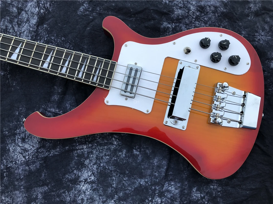 This is a professional 4-string bass electric guitar with a sunset color changing bright face. It has a beautiful tone