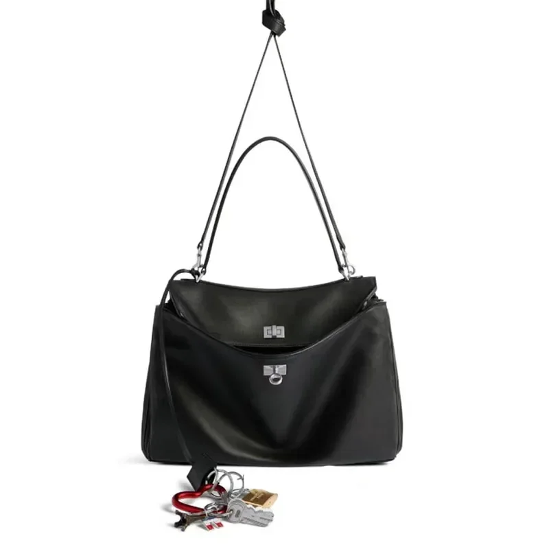 Rodeobag-Bolso de cuero genuino para mujer, bandolera cruzada inclinada, con hebilla de bloqueo, para las axilas, color dorado y negro, novedad