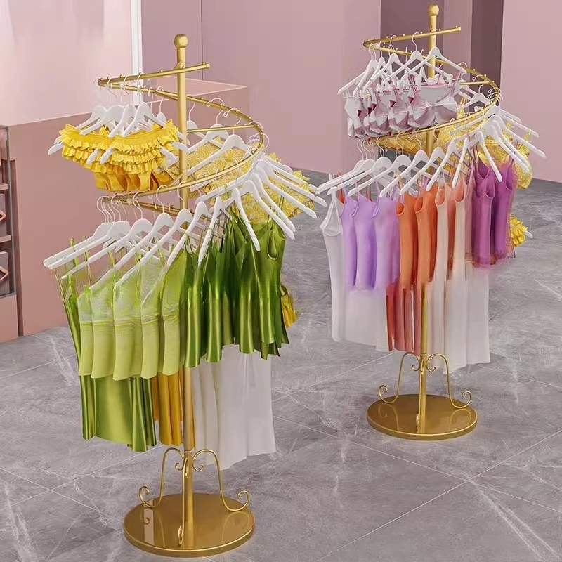 Swimsuit display with a hanger in the middle Wendian Nakajima wrought iron gold display rack