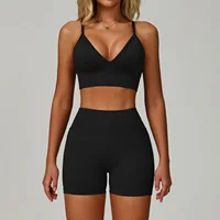 Women’s black sports bra and high-waisted fitted gym shorts set