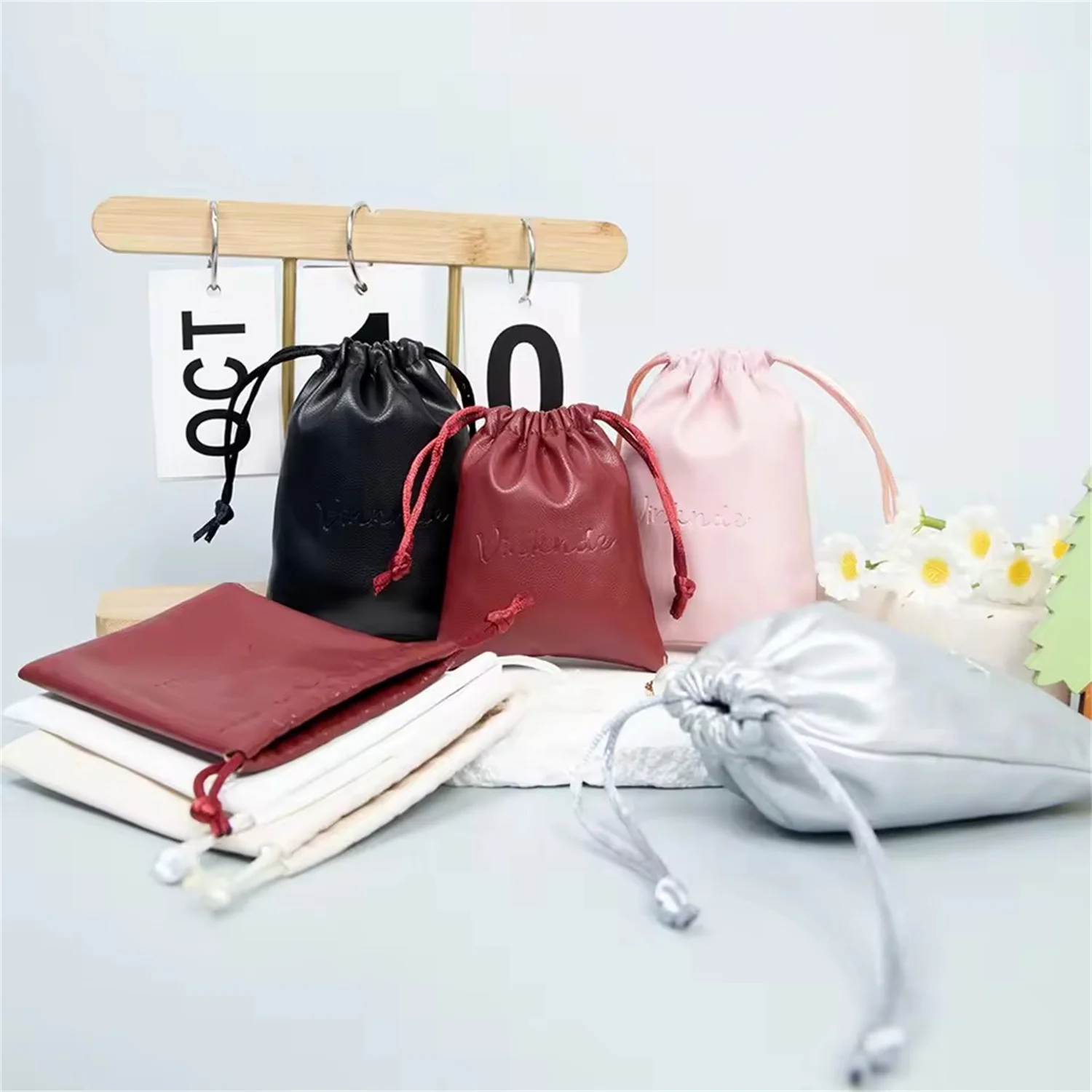 

100Pcs Custom Beige PU Leather Jewelry Drawstring Gift Bags 8x10cm 9x12cm 10x15cm 13x18cm Christmas Makeup Ring Drawstring Pouch