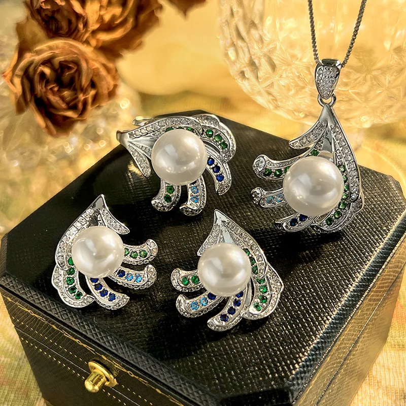 

New pearl jewelry set: earrings, ring, and necklace. Australian white pearls, silver pins. High-end and fashionable for women.