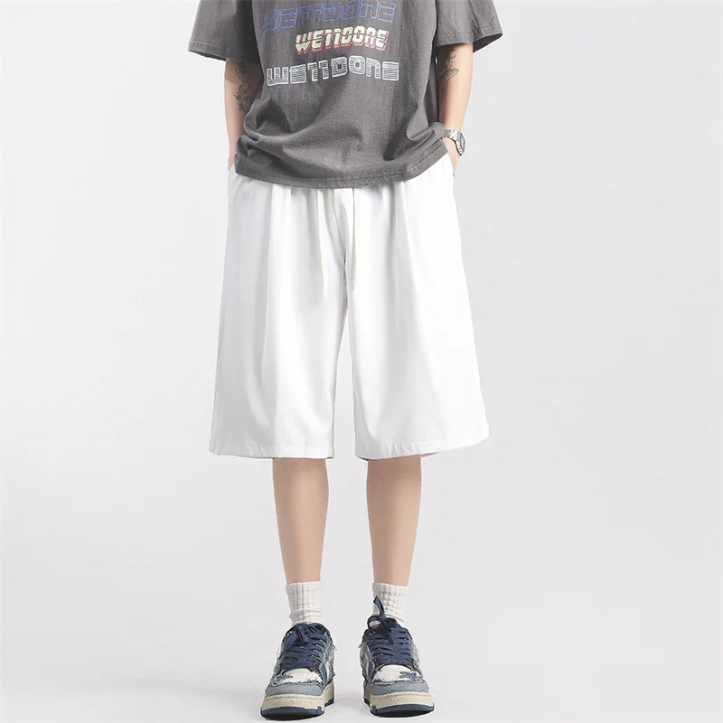 

Casual shorts new summer and spring capris men's Japanese loose fitting straight leg Hong Kong style ice silk pants beach sports