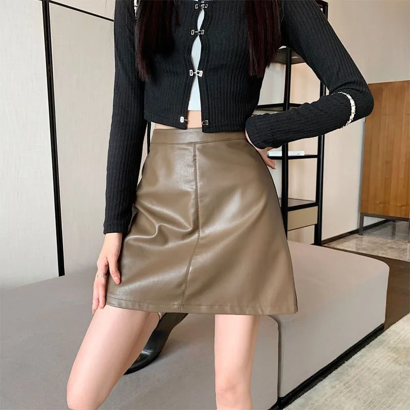 أسود بولي Leather الجلود التنانير الصغيرة النساء 2025 جديد الخريف الشتاء الكورية موضة عالية الخصر Bodycon تنورة السيدات التخسيس التنانير القصيرة