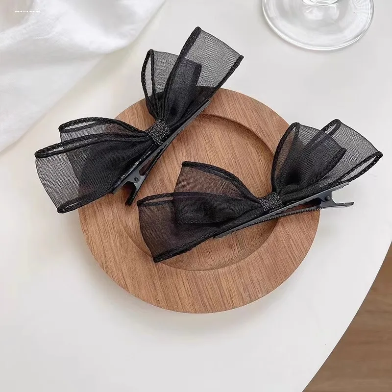 2026 Neu eingetroffen: 2er-Set elegante schwarze Haarspangen mit Schleife und Entenschnabel-Clip, modische seitliche Haarnadeln für Damen, ideal für den Alltag und Partys – Detail 6