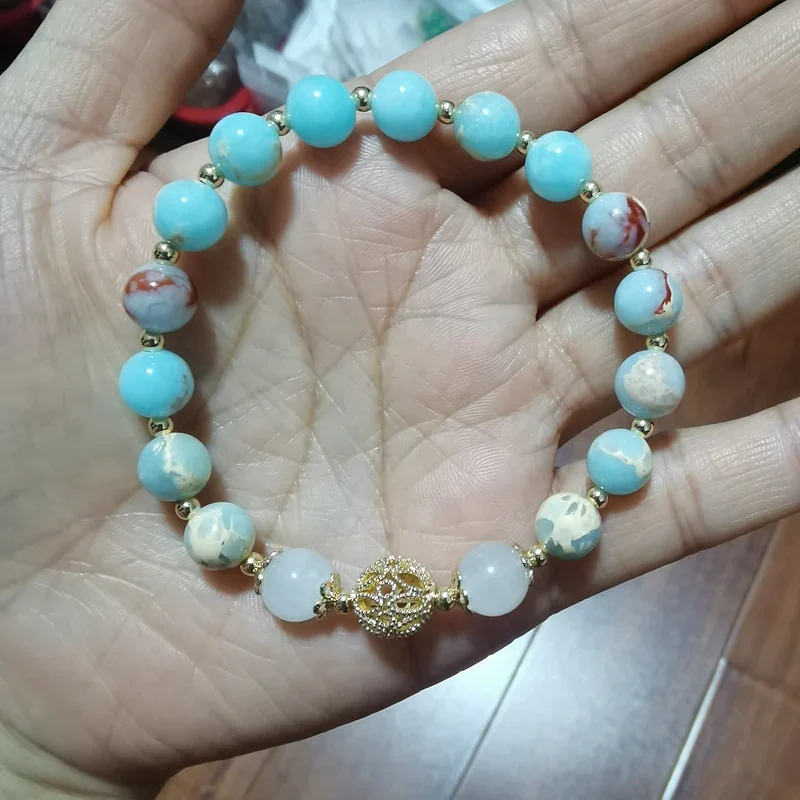 

AngLang Sky blue 8mm Shoushan Stones White Moonstones Gold color Hollowed Out Ball Strech Bracelets for Women Female YBR1135