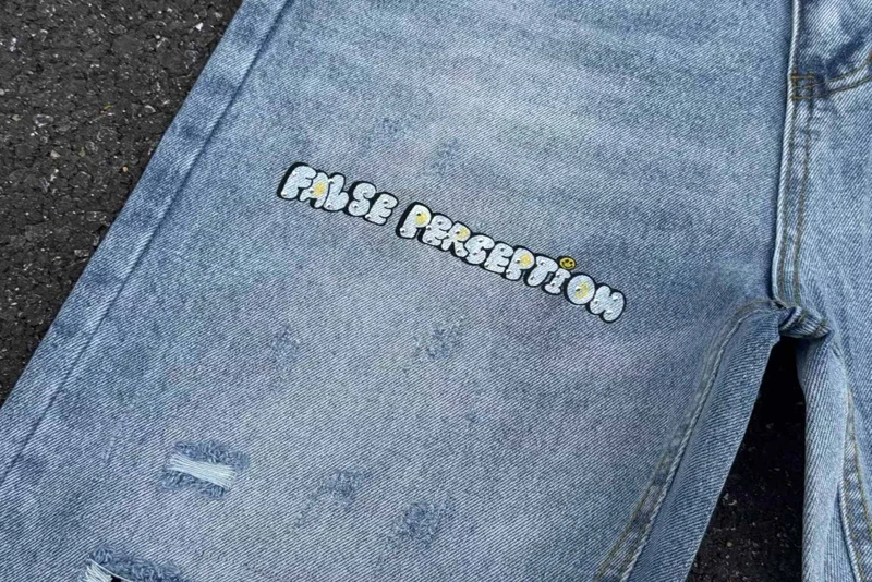 เย็บปักถักร้อยการรับรู้ปลอมเพชรการ์ตูน Graffiti กางเกงยีนส์ผู้ชายผู้หญิงคุณภาพสูง Hip Hop เสียหลวมตรงกางเกงยีนส์