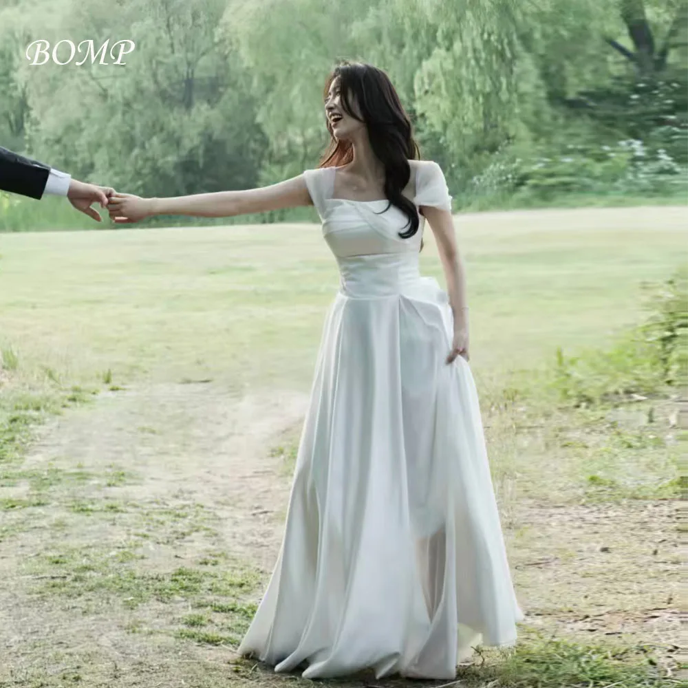 فستان BOMP أنيق لحفلات الزفاف على شكل قلب وأكمام قصيرة ثنيات بطول الأرض كوريا لالتقاط الصور فستان استقبال الزفاف حسب الطلب