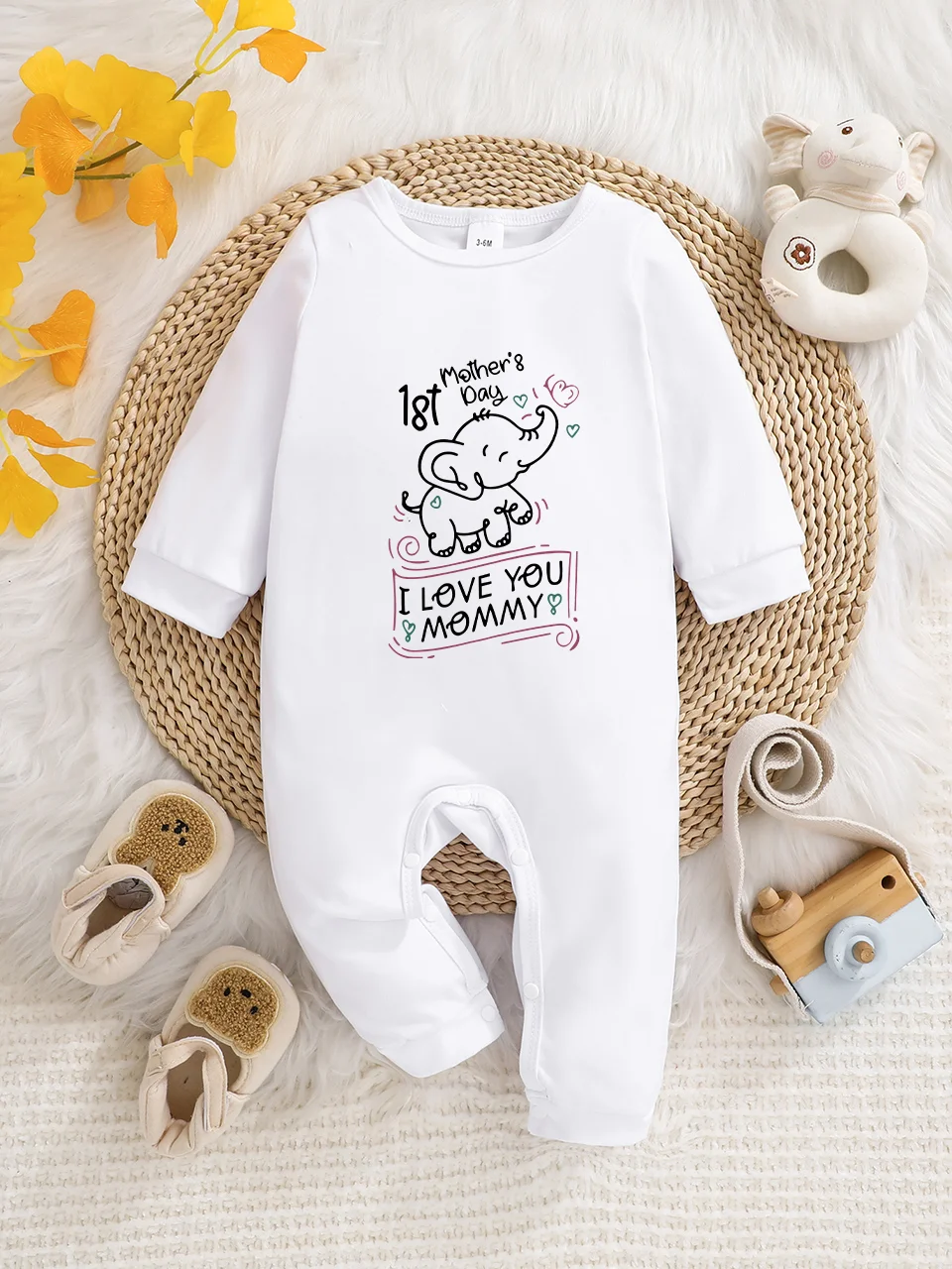 A baby long-sleeved onesie with interesting letter prints. It features a buttoned design for easy putting on and taking off, and