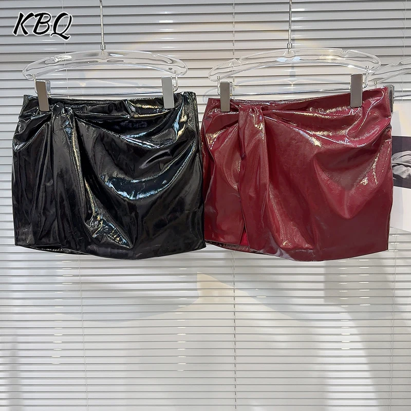 

KBQ Solid Spliced Fold Mini Skirts for Women High Waist Temperament Bow Embellished Leather Short Skirt Female Winter Fashion