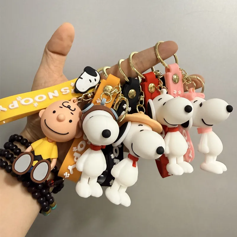 Cute and stylish new Snoopy cartoon dog design for 2026, can be used as a bag charm, backpack pendant, or car keychain.