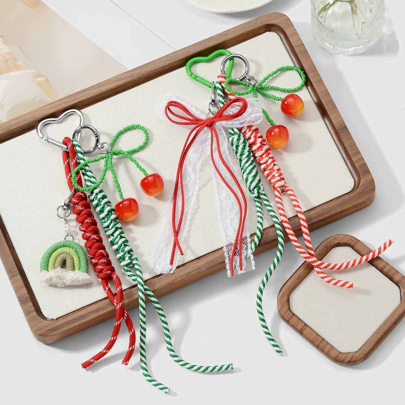 

Sweet, Cute, Fashionable Mesh Bead Bow Cherry Rainbow Weaving Rope DIY Keychain Pendant