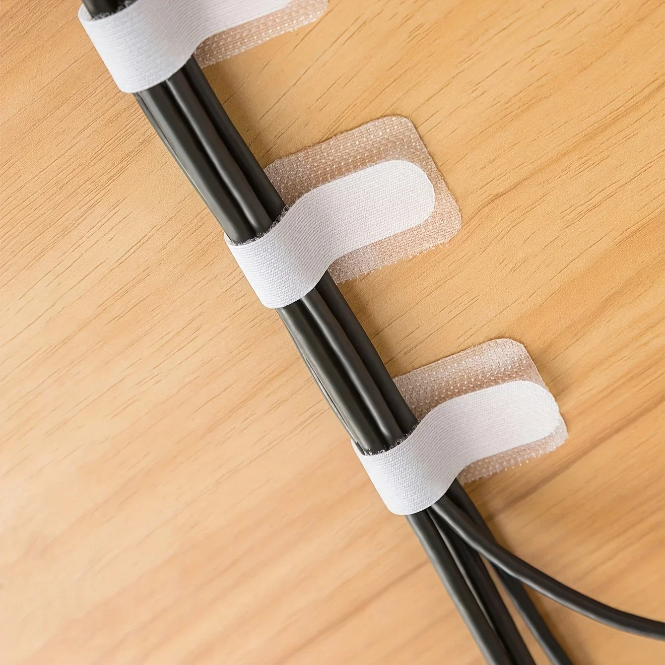 Adhesive Cable Clamp - A residue free flexible cable organizer with strong adhesion suitable for desktop walls homes and offices