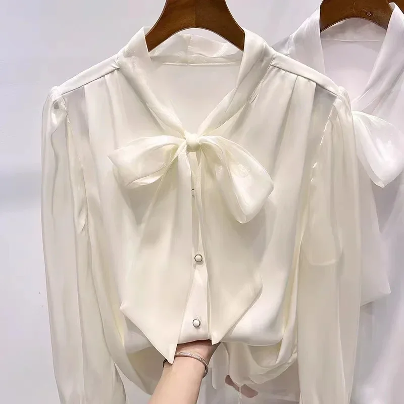 เสื้อชีฟองผู้หญิง แขนยาว แต่งริบบิ้น เสื้อผู้หญิงสไตล์เกาหลี แฟชั่นเสื้อเชิ้ตและเสื้อเบลาส์ ฤดูใบไม้ร่วง 2024 เสื้อผ้าผู้หญิง