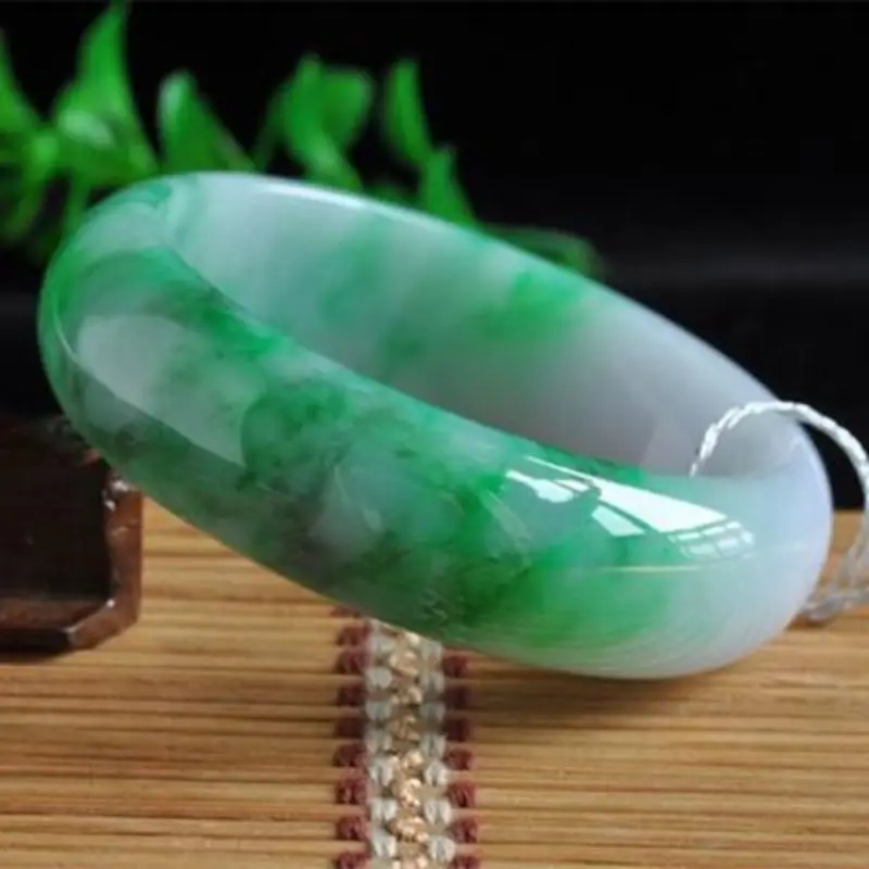 Natural Burmese ice-type light jadeite bracelet with spring-colored patterns wide round design featuring a bright green