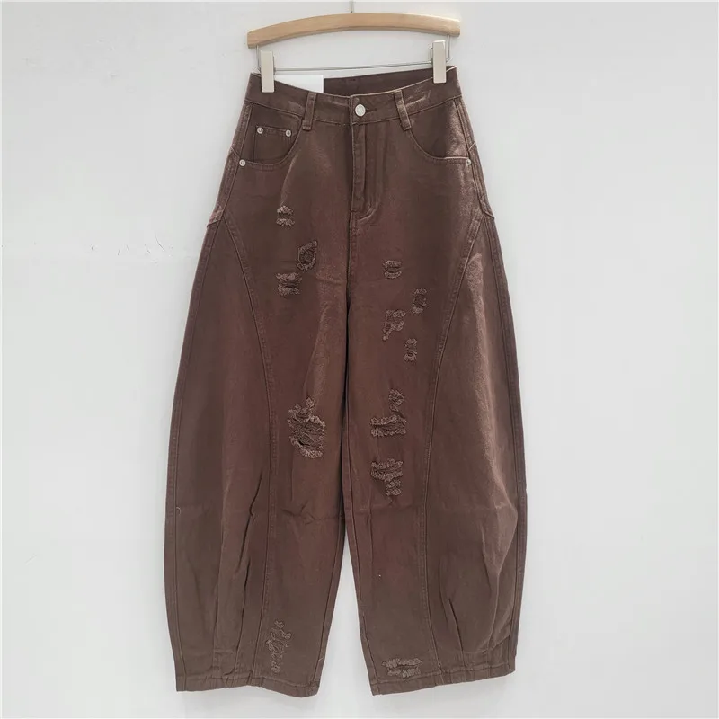 Vintage Americana Jeans: presenta patchwork, dobladillo curvo y patillas en una talla grande y holgada. La última pieza de declaración.