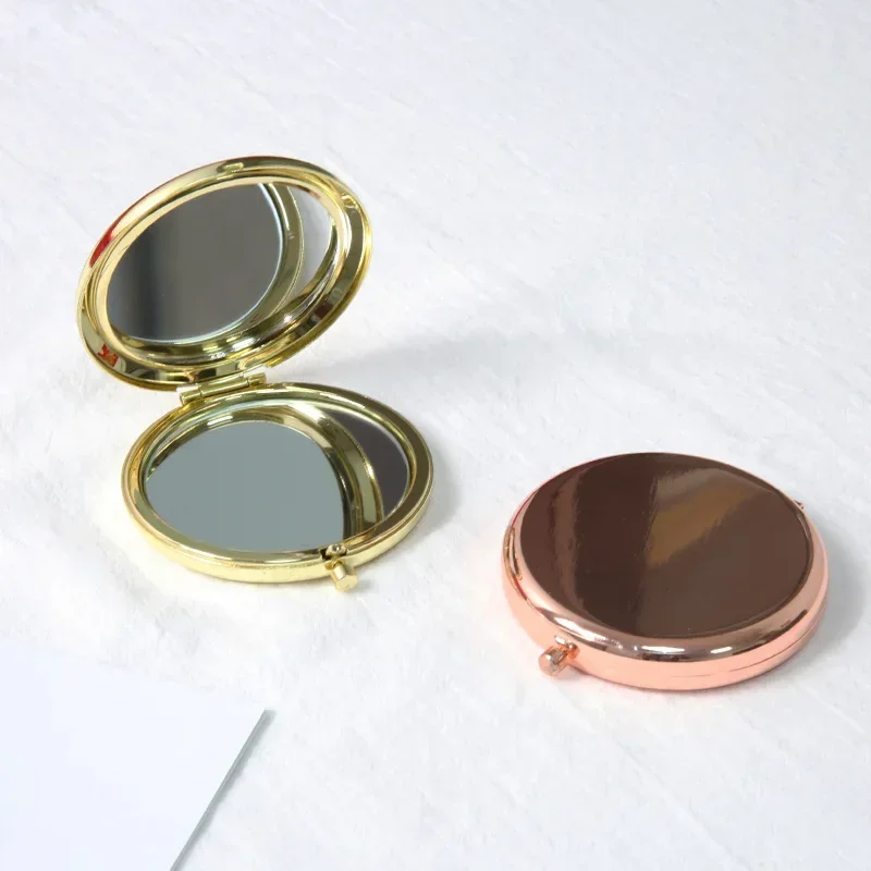 Miroir de poche rond double face en métal, mini miroir de maquillage pliant, tenu dans la main, cadeaux cosmétiques, sac à main de voyage